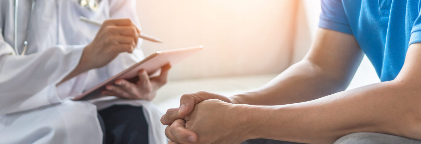 Close up of the arms of a doctor working with patient having consultation on diagnostic examination on gout, for new meds for gout tophi